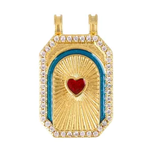 Detail view of a vintage tarot pendant with red heart and blue enamel accents.