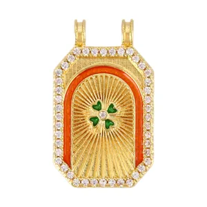 Vintage tarot style gold rectangular pendant with green four-leaf clover and CZ border