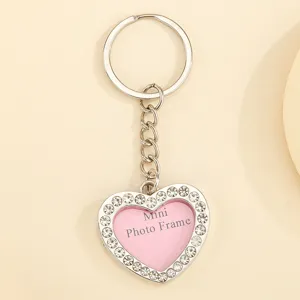 Silver rhinestone heart keychain with mini photo frame feature for lovers