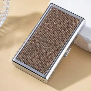 Macro view of luxurious silver cigarette case featuring full brown rhinestone decoration