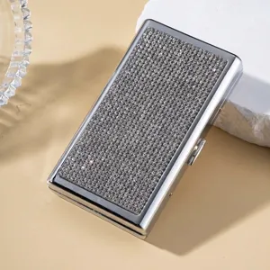 Macro view of luxury rectangular cigarette case with sparkling rhinestone inlay decoration