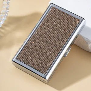 Luxurious silver cigarette case with brown rhinestone inlay for business gifting.