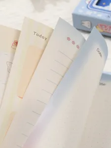 Close-up of colorful inner pages in pixel game themed notebook with Date and Title prompts