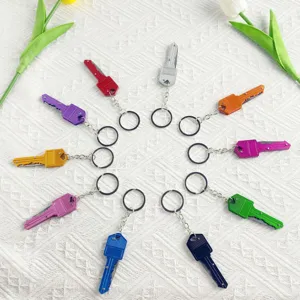 Diverse collection of colorful mini key-shaped folding knives in a radial arrangement.