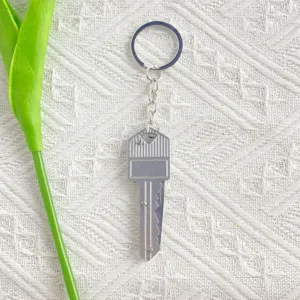 Portable silver mini key-shaped folding knife keychain for daily use and EDC detail