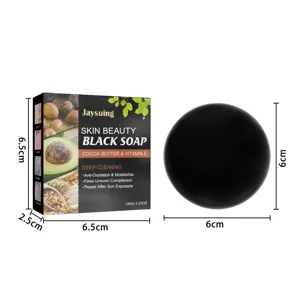 Detail view of Jaysuing black soap packaging and round soap bar with clear dimension guides.