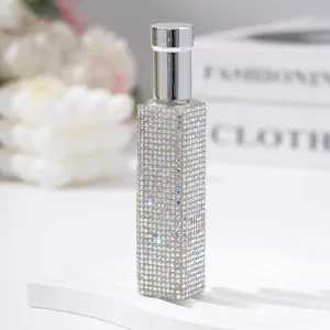 Detail of 10ml rhinestone perfume atomizer travel spray bottle with silver cap.