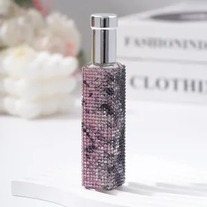 Luxurious 10ml rhinestone encrusted perfume spray bottle for travel and elegance.