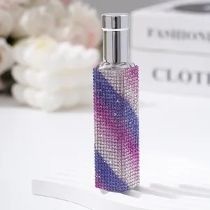Detail shot of a 10ml glass perfume atomizer with gradient purple and blue rhinestones