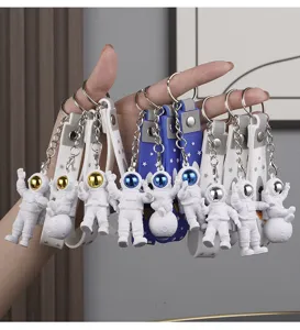Cute astronaut keychain electroplated cartoon doll key ring stylish bag pendant gift.