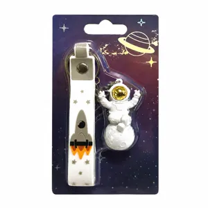 Creative astronaut keychain with rocket strap and space theme backing card for gifts.