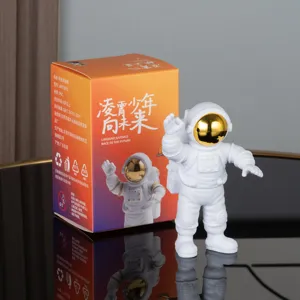 Cute astronaut figurine toy with colorful gift box, perfect PVC space man decor gift.