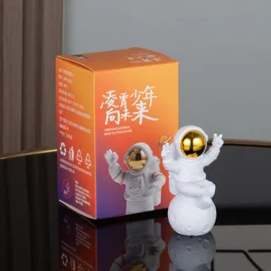 Astronaut figurine ornament with packaging box, cute cartoon space man desktop decor for kids gifts.