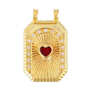 Detailed view of vintage gold tarot card pendant with red heart and clear crystals