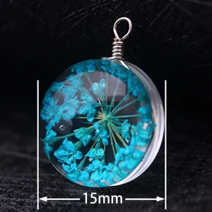 Detailed macro view showing a 15mm diameter blue dried flower glass ball pendant