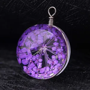 Forest style handmade glass pendant necklace with purple dried flowers in wire wrap