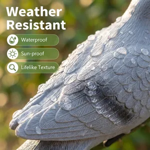 Close-up detailed view of realistic resin bird sculpture showing lifelike feather texture.