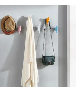 Modern bird-shaped decorative wall hooks for organizing keys, coats, and bags in hallway.