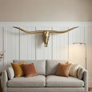 Vintage brass longhorn skull wall decor, rustic faux animal taxidermy for living room bar.
