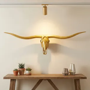 Close-up view of the vintage gold longhorn bull skull wall hanging, ideal for rustic home decor.