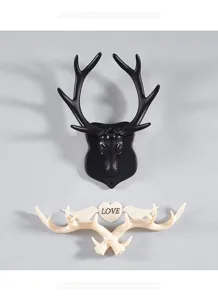 Gedetailleerd overzicht van creatieve hertenantenne wandhaken, decoratieve ophanging.