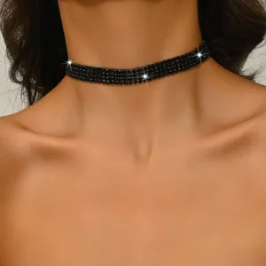 Close-up detail of the multi-row black rhinestone claw chain choker necklace, stunning sparkle design.