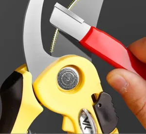 Garden pruning shear sharpening tool detail view, professional tree trimmer maintenance gear
