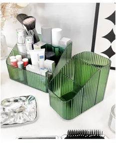 Transparent green cosmetic organizer desktop makeup storage box with multiple grid partitions.