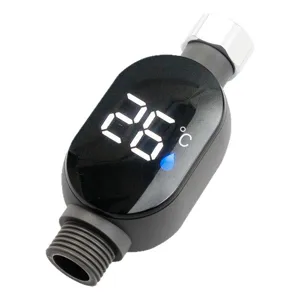 Macro view of digital LED display screen on shower thermometer showing 26 degrees Celsius