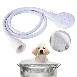 Close-up of pet shower sprayer with flexible white hose and faucet adapter for grooming.