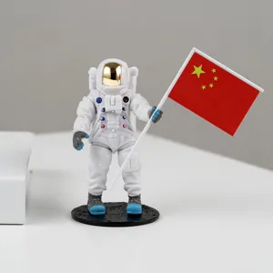 Creative astronaut car decoration figurine holding national flag resin ornament for auto interior