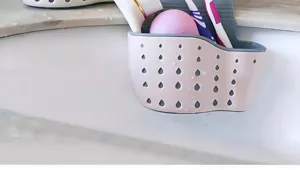 Sink hanging drainage caddy for kitchen sponge and toothbrush storage organization tool.