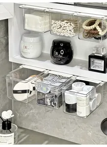 Transparent hanging organizer for bathroom mirror cabinet, ideal for cotton pads and cosmetics.