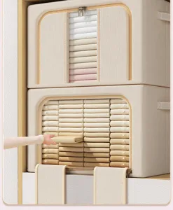 Detail of fabric clothes storage box showing neat stacking and clear window in wardrobe.