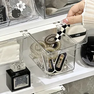 Transparent plastic desktop storage drawer for cosmetics and small items bathroom organizer.