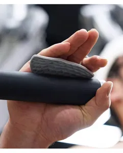 Silicone gym palm grip detail shot, anti-slip texture for weightlifting pull-ups training.