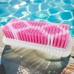 Durable plastic laundry brush with dense pink and white bristles for efficient clothes cleaning.