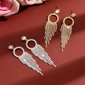 Sparkling rhinestone tassel drop earrings in gold and silver finish close-up view