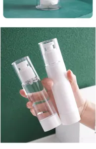 Detailed shot of portable travel refillable vacuum pump bottles for lotion and skincare products.