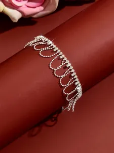 Detailed close-up of the sparkling silver rhinestone fringe anklet showcasing delicate tennis chains.