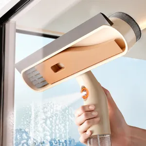 Multi-functional window cleaning brush with press spray handle for household glass wiping.