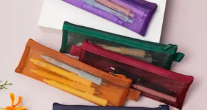 Minimalist mini transparent mesh pencil case, portable student stationery storage bag.