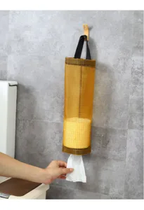 Wall-mounted mesh grocery bag holder, durable plastic storage dispenser for kitchen use.