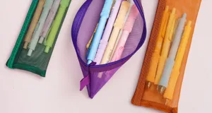 Transparent mesh pencil case, portable stationery storage bag for students and office use.