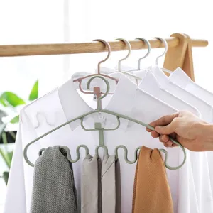 Multi-functional wave clothes hanger with multiple hooks for home and dorm organization.