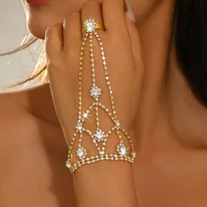 Detailed view of the sparkling rhinestone hand chain and delicate finger ring design closeup.