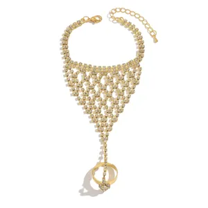 Exquisite rhinestone hand chain bracelet with ring, chic hollow out design for women.