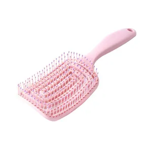 Pink curved vent hair brush for daily hair styling, detangling, and volume boosting.