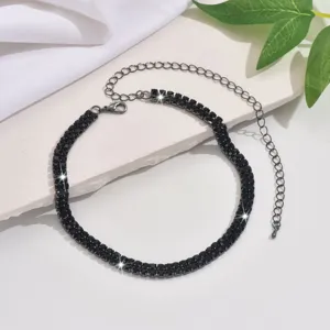 Black rhinestone choker necklace detail shot, sparkling crystal claw chain with extension.