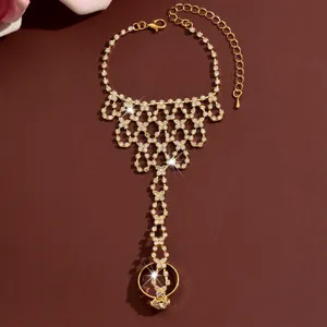 Detailed view of the gold rhinestone slave bracelet, showcasing sparkling crystal details.